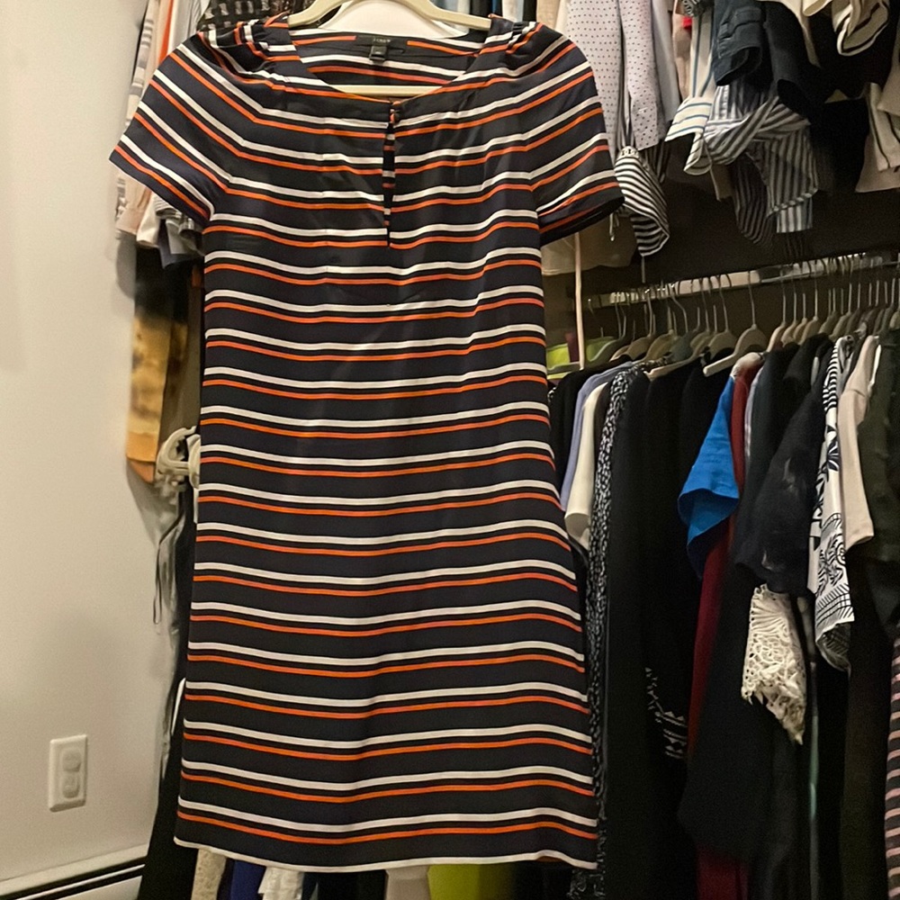Jcrew silk dress definitely worn dress.  Color is navy, white stripes, orange